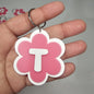 Llaveros de flor con letras