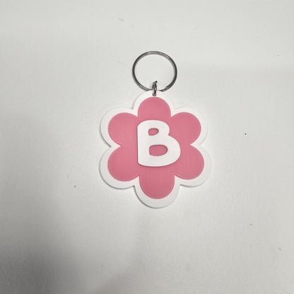 Llaveros de flor con letras