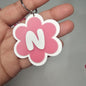 Llaveros de flor con letras