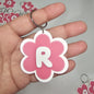 Llaveros de flor con letras