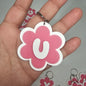 Llaveros de flor con letras