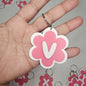 Llaveros de flor con letras